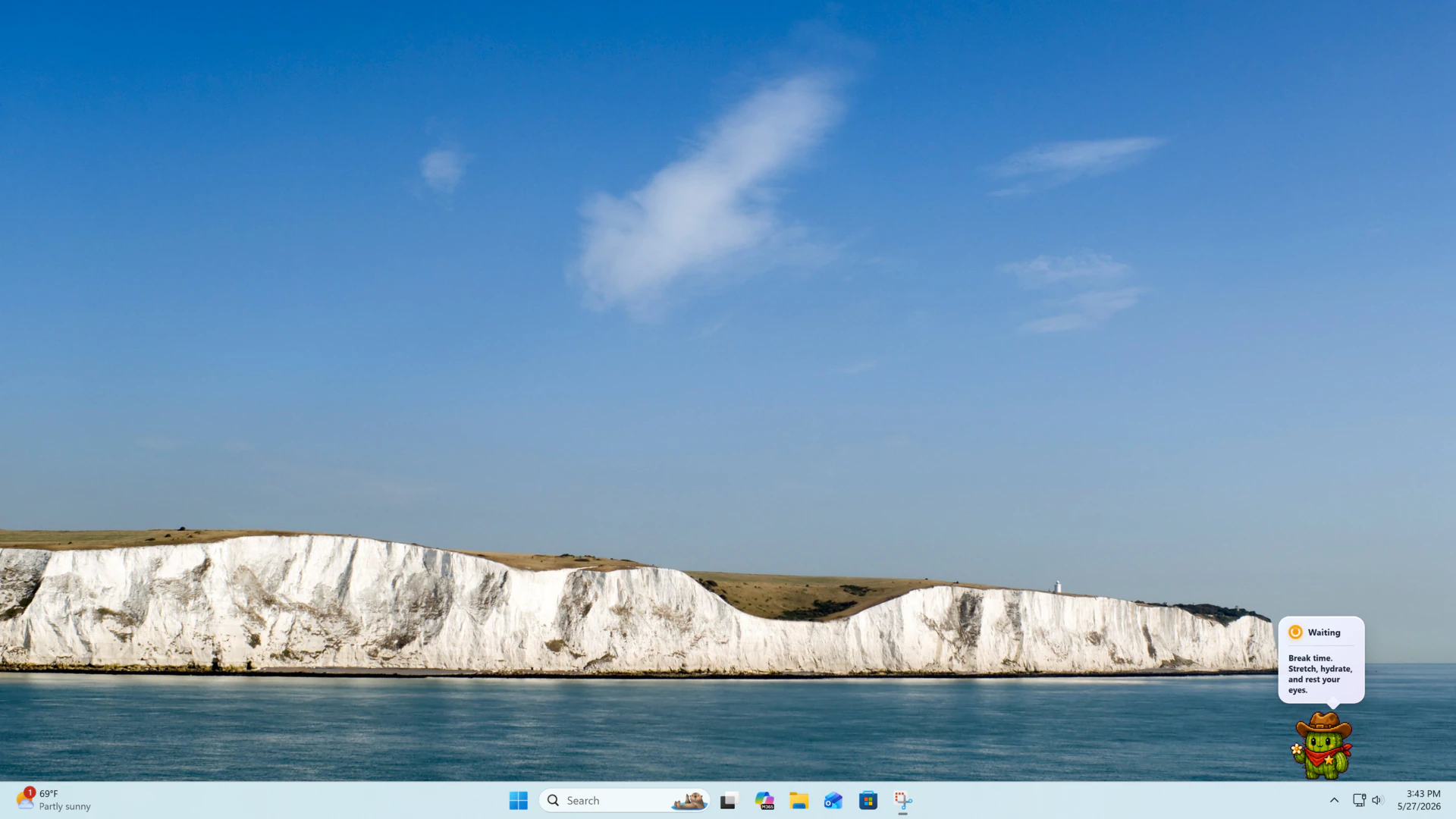 OpenPets companion on a live Windows desktop showing a break reminder speech bubble above the taskbar